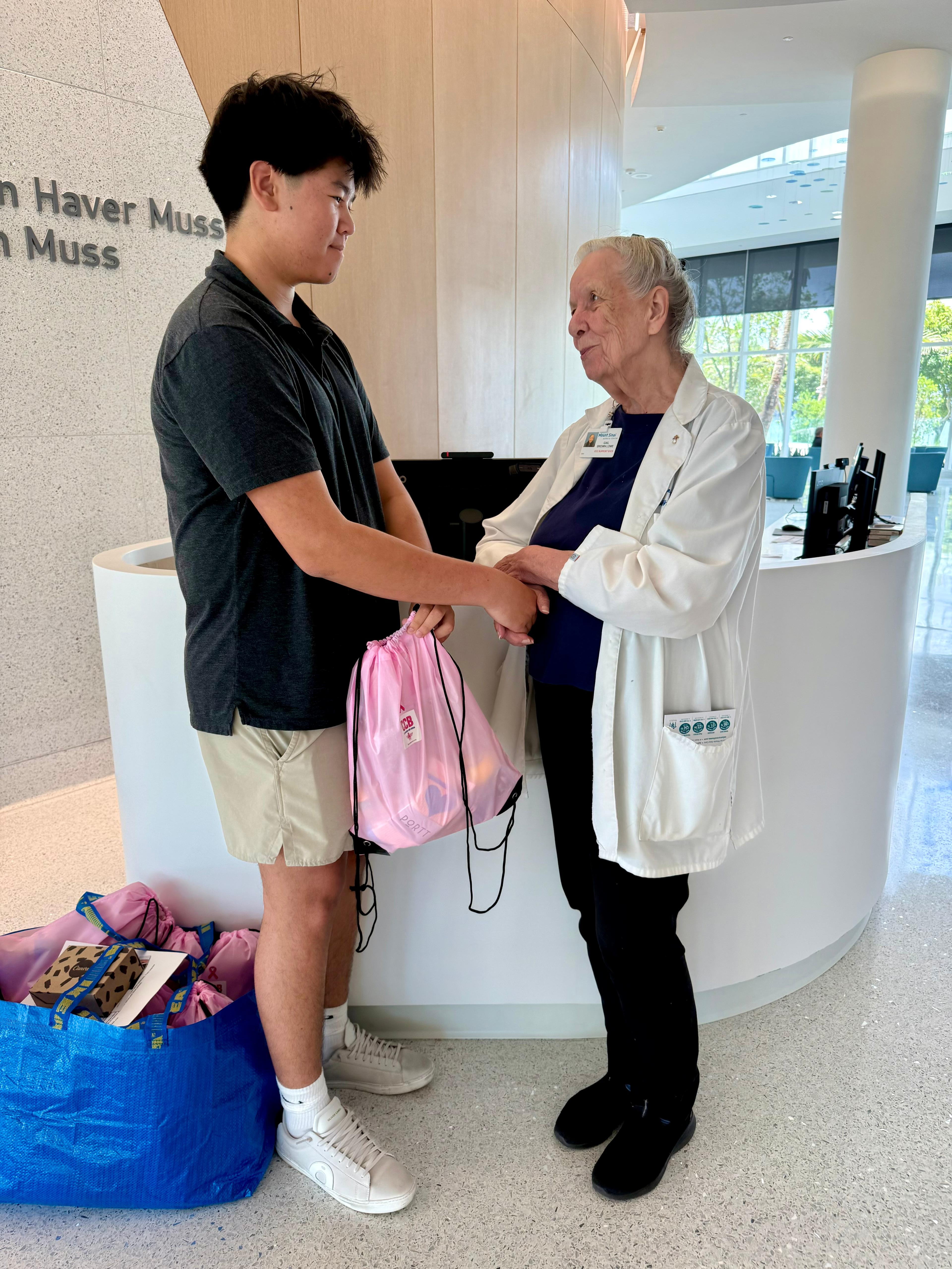 Brandon delivering baskets to Gail Brown at Mount Sinai in 2026
